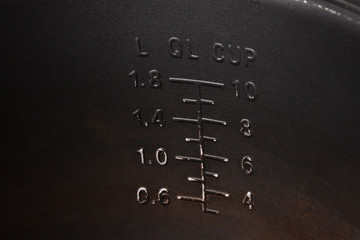 Measuring scale on the wall of a metal pot