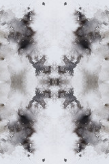 abstract black splashes on white watercolor paper. monochrome image.