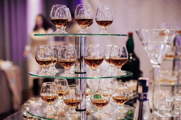 Glasses of cognac on the buffet table.  Cocktail reception