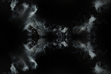 abstract splashes on black background. monochrome image.