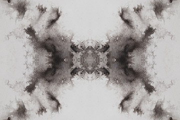 abstract black splashes on white watercolor paper. monochrome image.