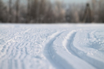 Fototapeta na wymiar Ski track in snow , active winter holiday concept.