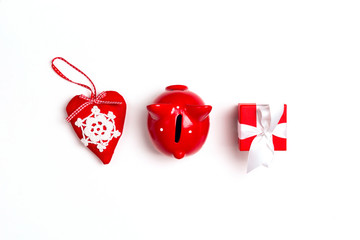 Heart, piggy bank and gift on white background.