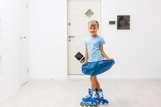 Little Girl Roller Skates At Home