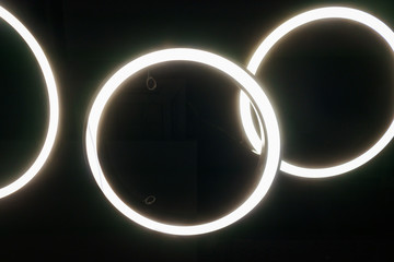 Black design details of the modern device ceilings in the room. Lighting design, lamps and fixtures.