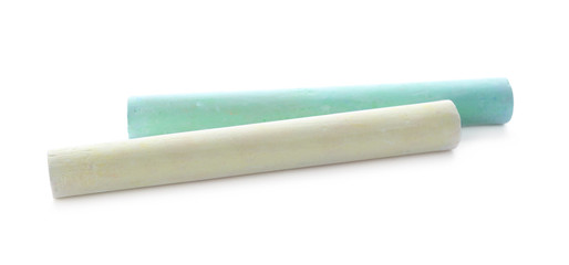 Color pieces of chalk on white background