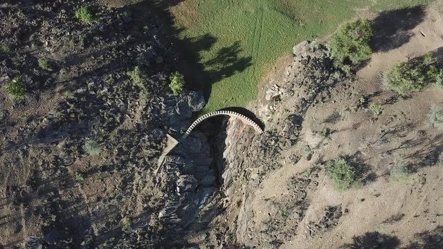 4K aerial drone summer day video of African savanna, Stengel water dam surrounded by bushy hills, Daan Viljoen National Reserve, Khomas Hochland area near Windhoek, Namibia's capital, southern Africa