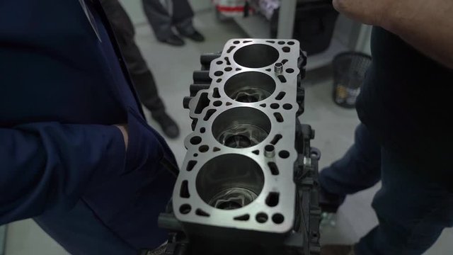 Engine car repair disassembled crankcase at service station internal of machine vehicle black motor camera movement