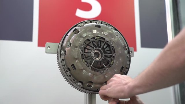 Engine flywheel repairs at service station internal parts of machine vehicle motor camera movement