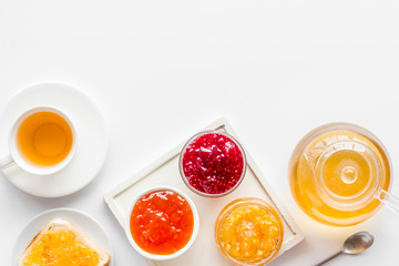 Tea party with jam. Toast, teapot, cup on white background copy space
