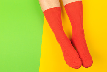 legs in colorful socks on colorful  background - Image