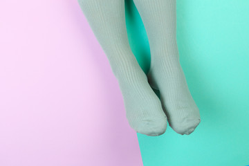 legs in colorful socks on colorful  background - Image