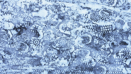 footprints on the footpath in the Park in winter