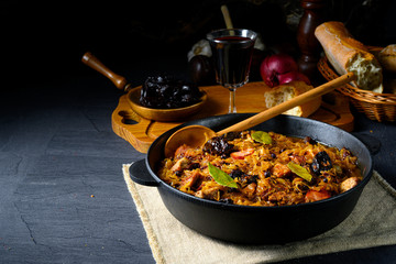 A real Polish 'Bigos,'after an old recipe with dried plums and wine. - obrazy, fototapety, plakaty