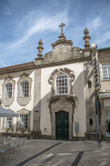 Fototapeta na wymiar View at a classic baroque facade building on Viseu city Downtown, Portugal