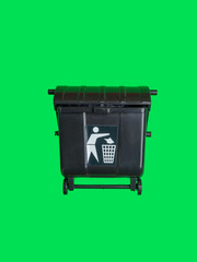 Black trash toy can or recycle bin isolated on green.