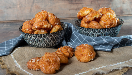 Chouquette, french choux pastry on the wooden table