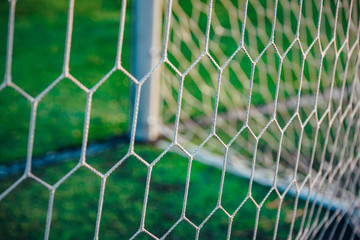 Soccer net on green background, football photo