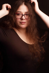 portrait of a brunette with long curly hair