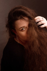 portrait of a brunette with long curly hair