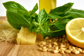 Ingredients for pesto sauce on wooden background