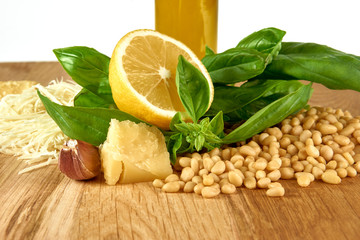 Ingredients for pesto sauce on wooden background