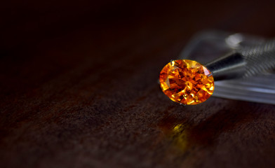 Yellow gem Beautiful on the wooden floor	