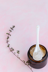 Hygiene bath product. Body, face scrub on pink background. Wellness therapy regeneration