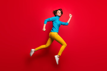Fototapeta na wymiar Full size profile side photo of cute charming candid girl jump run after black friday bargain wear casual style clothing isolated over vibrant color background