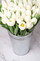 white tulips in a bucket