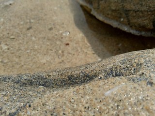 Fototapeta na wymiar Sand and the rock natural background