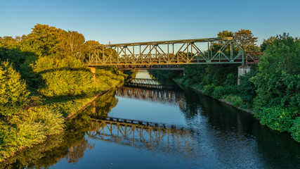 Fototapeta na wymiar Railway bridges over the Schifffahrtskanal (canal for ships) in Duisburg, North Rhine-Westfalia, Germany