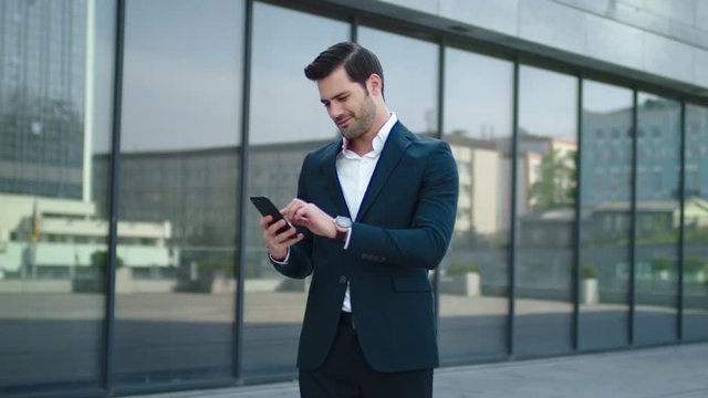 Closeup Man Receiving Good News At Street. Business Man Using Phone Outdoor