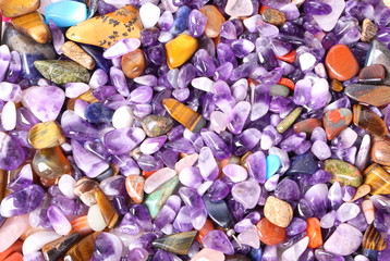 Collection of small semiprecious gemstones. Background image.