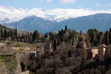 Granada Spain, Panorama of Sierra Nevada mountains with the Alhambra gardens in the foreground