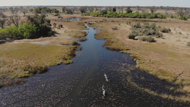 A drone shot of two mokoro boats in the Okovango Delta near Maun, during dry season.