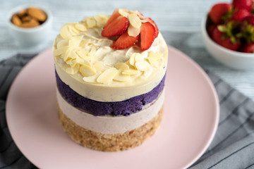  cake with cream and strawberries. Raw dessert with berries. Strawberries and almonds. Layer cake.