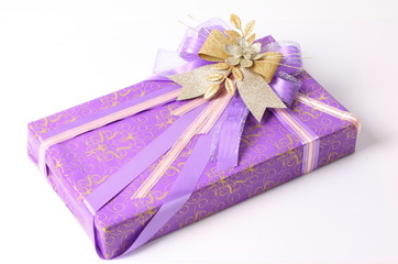 Purple bow on purple gift box background