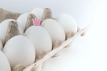 conceptual photo of personality. egg with a crown