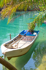 Naklejka na ściany i meble fishing boat on the river in the tropics