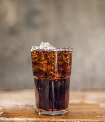 Soft drink splashing on wood table.