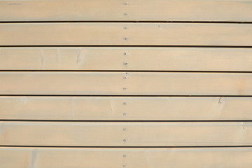 Wooden texture background with horizontal planks in sunlight