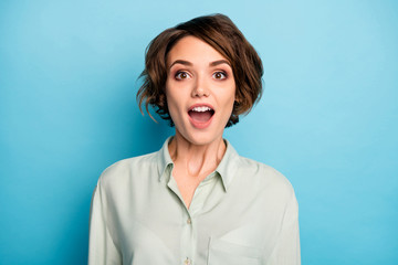 Obraz na płótnie Canvas Closeup photo of attractive business lady short bob hairstyle good mood open mouth listen boss promoted her wear casual green shirt isolated blue color background