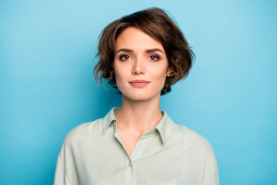 Photo Of Nice Attractive Business Lady Short Bob Hairstyle Not Smiling Serious Responsible Person Wear Casual Formalwear Green Shirt Isolated Blue Color Background