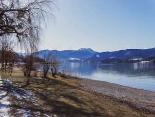 Gmund am Tegernsee in Upper Bavaria. View from Kaltenbrunn to magical calm waters of the lake of Tegernsee in winter