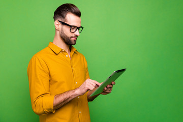 Profile side view portrait of nice attractive focused content guy in formal shirt holding in hand...