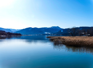 Gmund am Tegernsee in Upper Bavaria (Oberbayern) and view to magical waters of the lake and mountains lanscapes from the north shore of the Tegernsee lake in winter