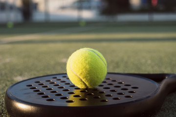 paddle tennis objects in court, detail of racket and balls