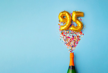 95th anniversary champagne bottle balloon pop