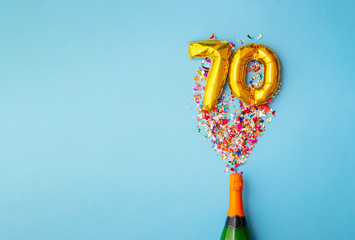 70th anniversary champagne bottle balloon pop - obrazy, fototapety, plakaty